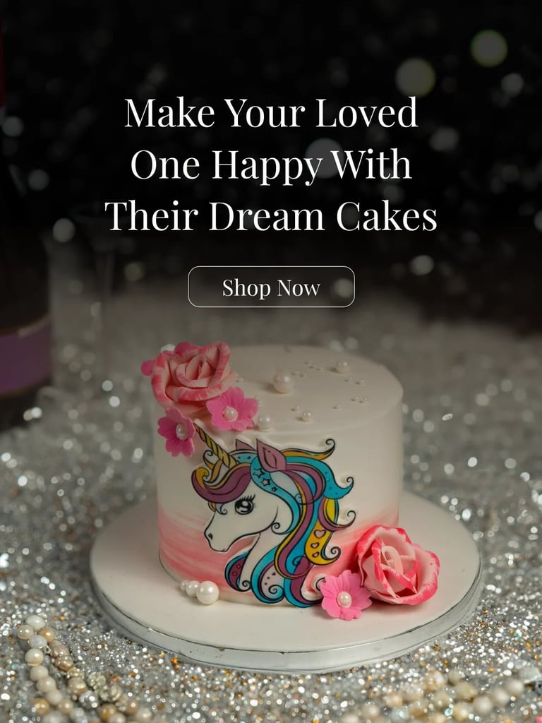 White decorative cake with colorful unicorn design and pink flowers on glittery surface