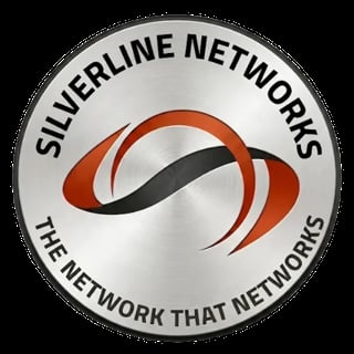 Silverline Networks logo with red and black curved design on silver circular background, tagline The Network That Networks